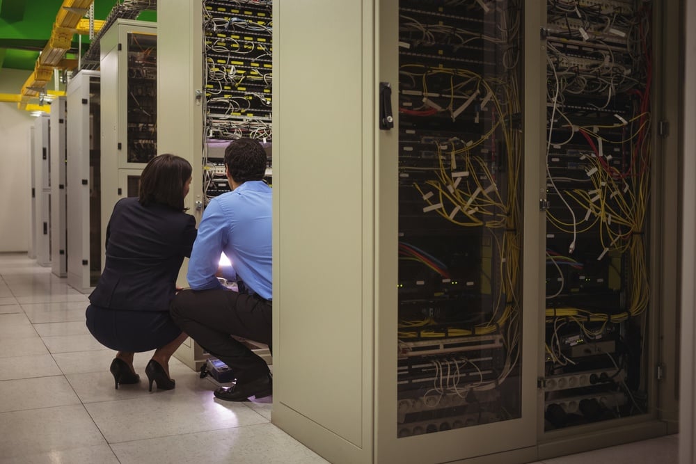 Technicians analyzing server in server room-1